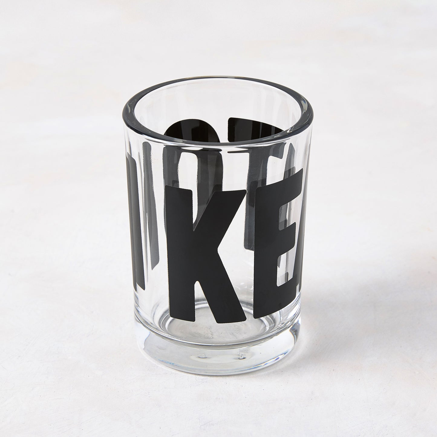 Clear glass "Keaton" Everyday Wine Glass with bold black "KEATON" signature by Diane Keaton x Hudson Grace.