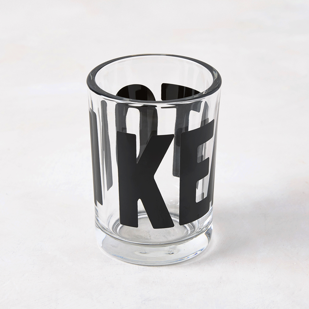 Clear glass "Keaton" Everyday Wine Glass with bold black "KEATON" signature by Diane Keaton x Hudson Grace.