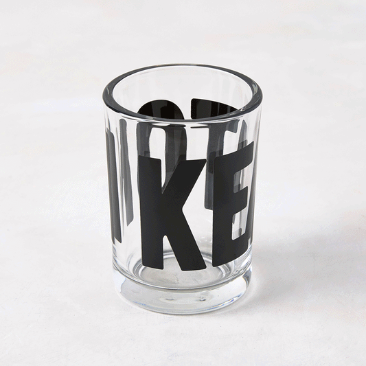 Clear glass "Keaton" Everyday Wine Glass with bold black "KEATON" signature by Diane Keaton x Hudson Grace.