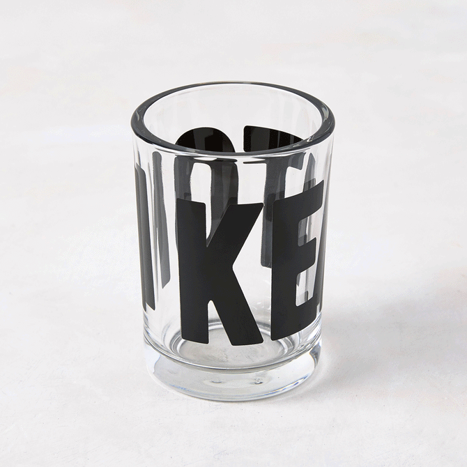 Clear glass "Keaton" Everyday Wine Glass with bold black "KEATON" signature by Diane Keaton x Hudson Grace.