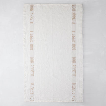Khaki "Bon Appetit" linen hand towel, 25.7"L x 17"W, with "Bon Appetit" text on vertical borders.