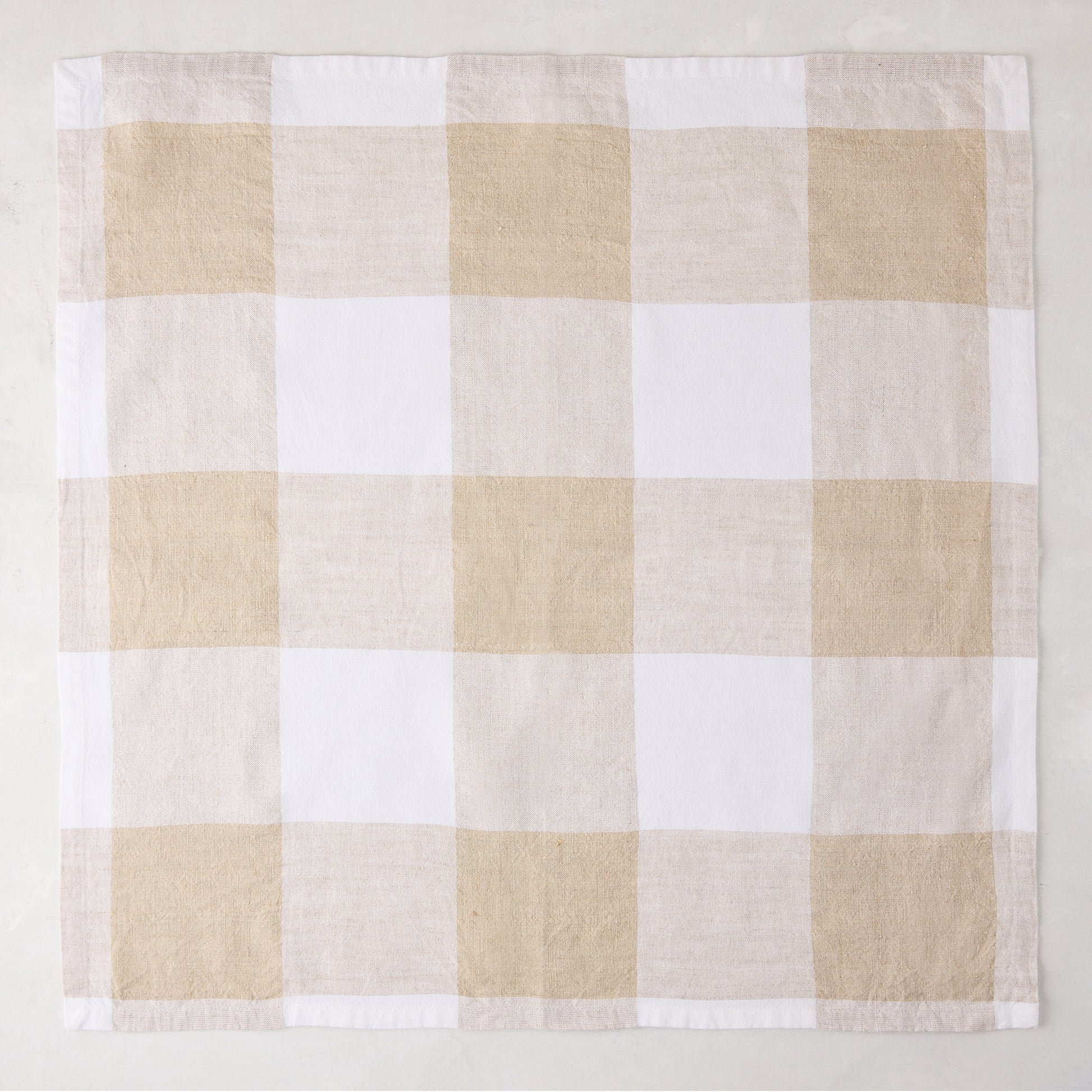 Khaki buffalo check linen napkin, 20" x 20", folded square.