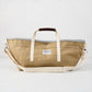 Khaki canvas garden tote bag with olive green exterior, grey interior, brown leather grips, and long shoulder strap.
