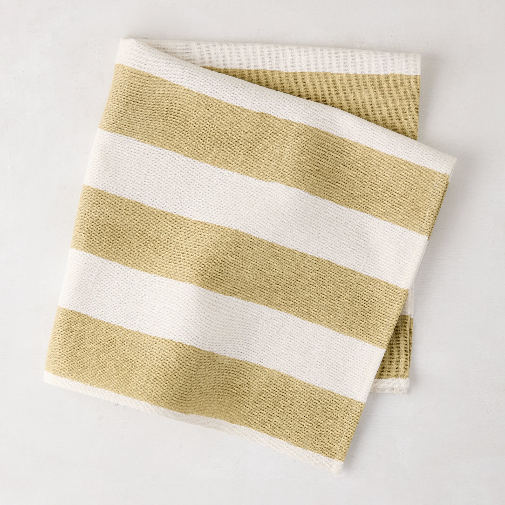 Khaki Hampton Stripe cotton napkin, folded, with bold khaki and white horizontal stripes.
