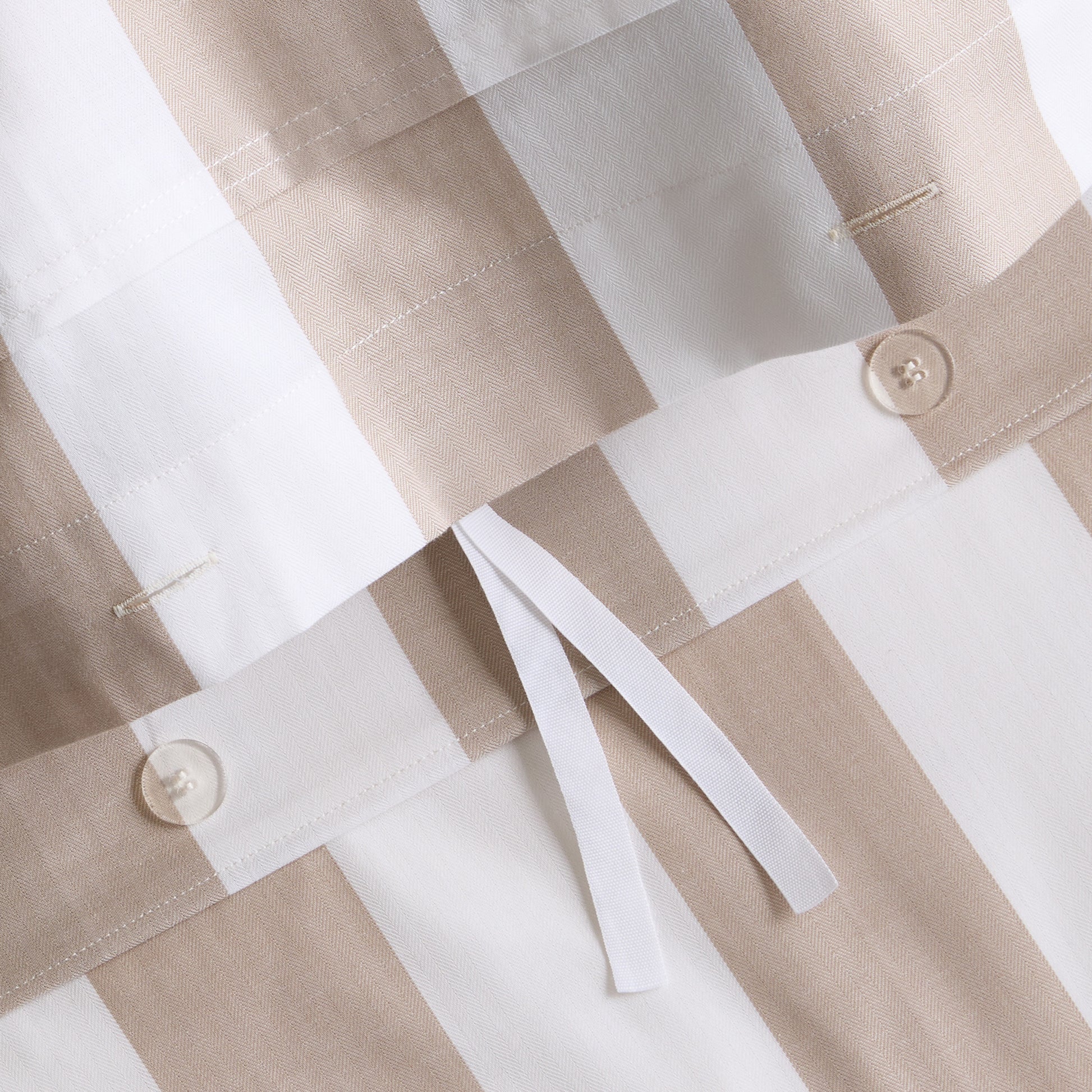 Khaki and white wide-stripe cotton duvet cover with herringbone texture and tie closures.