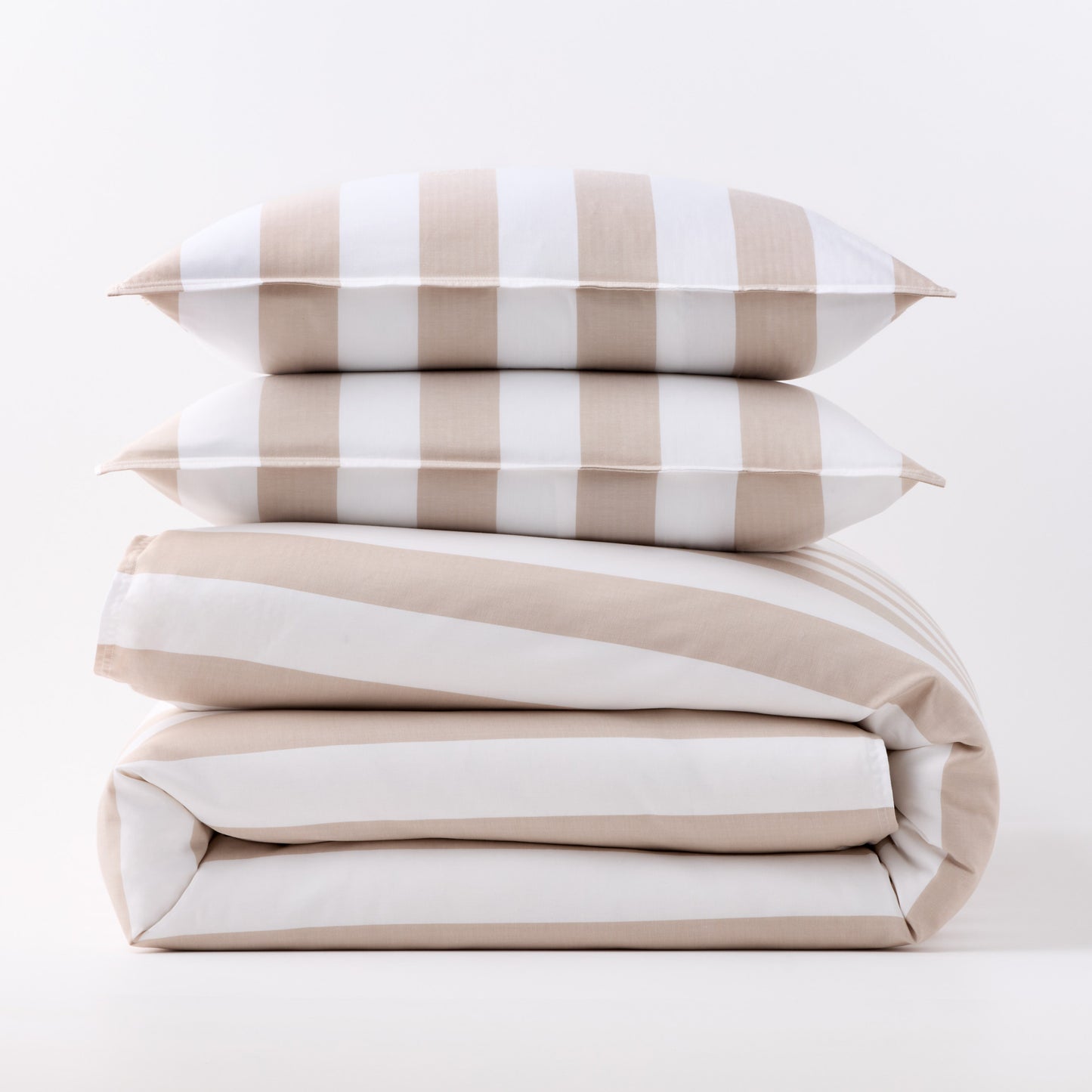 Khaki and white wide-striped duvet cover folded with two matching rectangular pillow shams stacked on top.