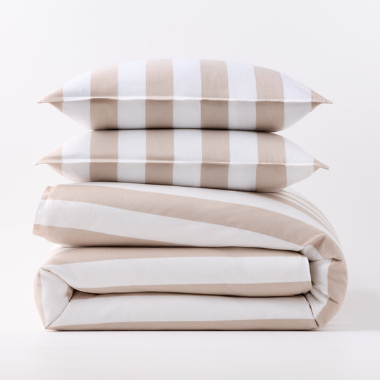 Khaki and white wide-striped duvet cover folded with two matching rectangular pillow shams stacked on top.