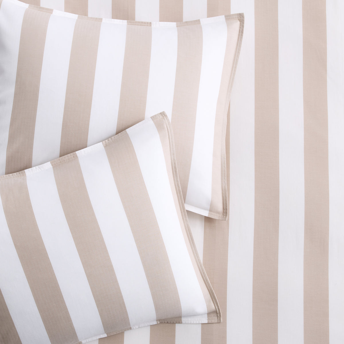 Set of two khaki and white wide-striped euro shams featuring a subtle herringbone texture.
