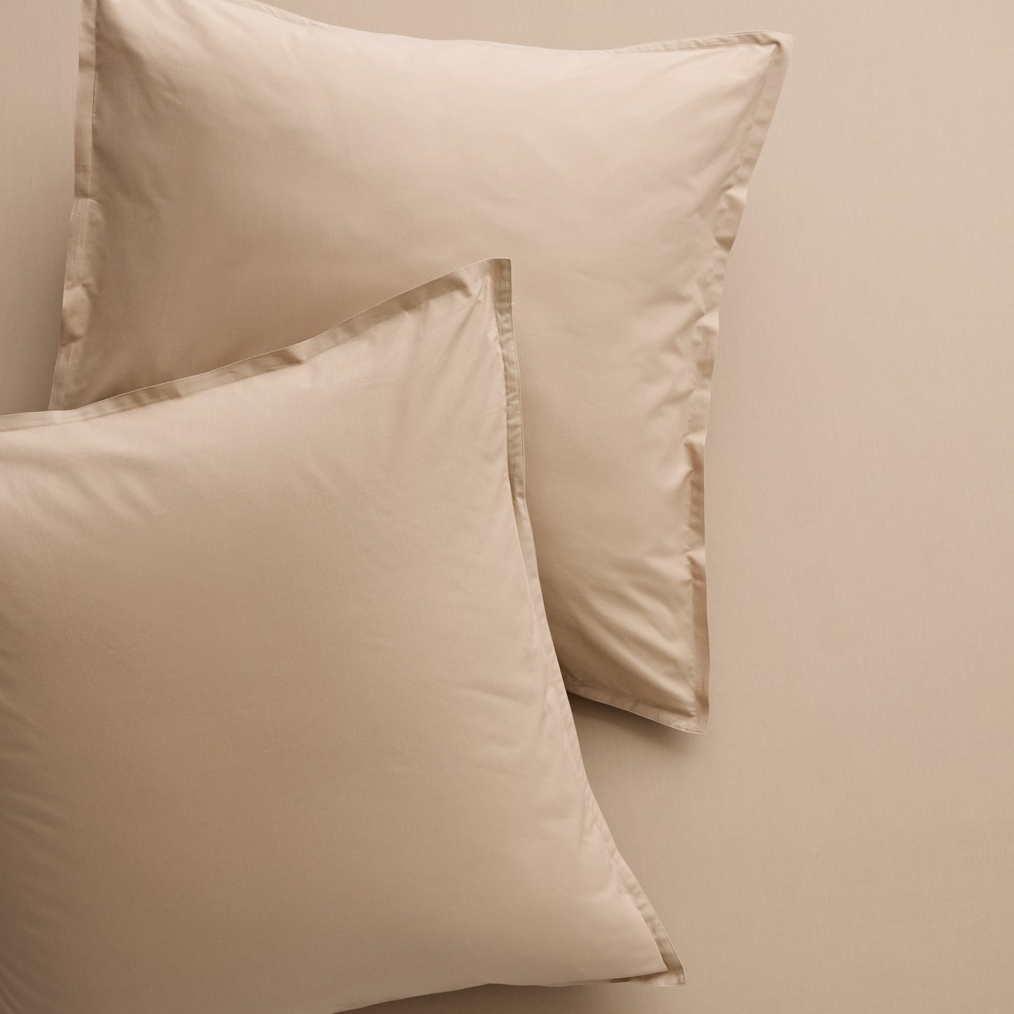 Two Khaki Italian Percale Euro Shams, soft cotton fabric with envelope closures.