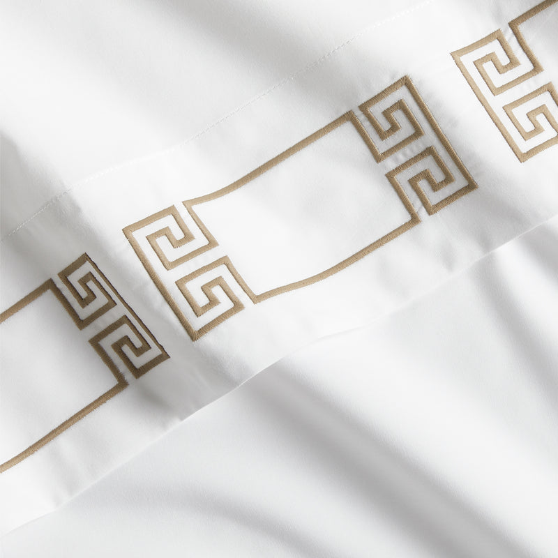 White percale sheet set with khaki embroidered Greek key border.