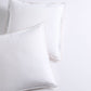 Set of 2 white percale Euro shams with khaki piping and double-stitch detailing.