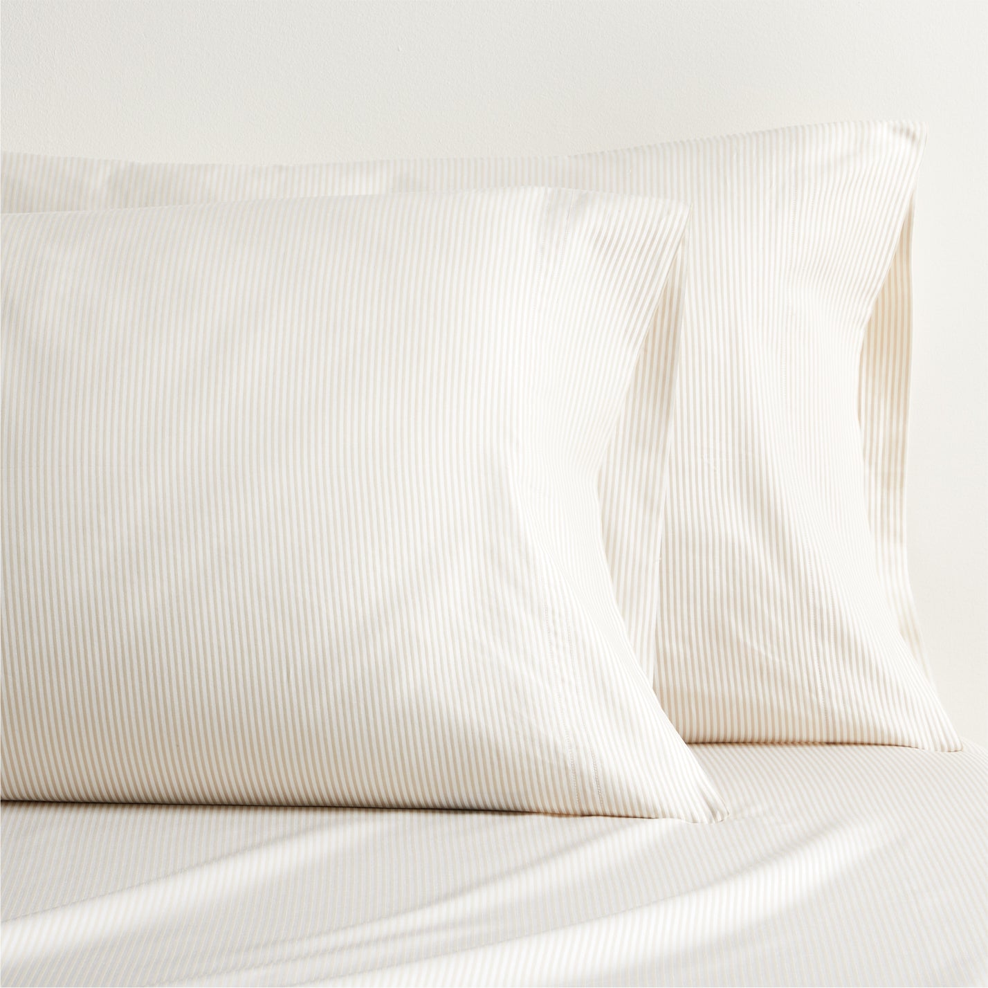 Khaki Stripe Cotton-Chambray Sheet Set with two pillowcases and fitted sheet, featuring thin woven stripes.