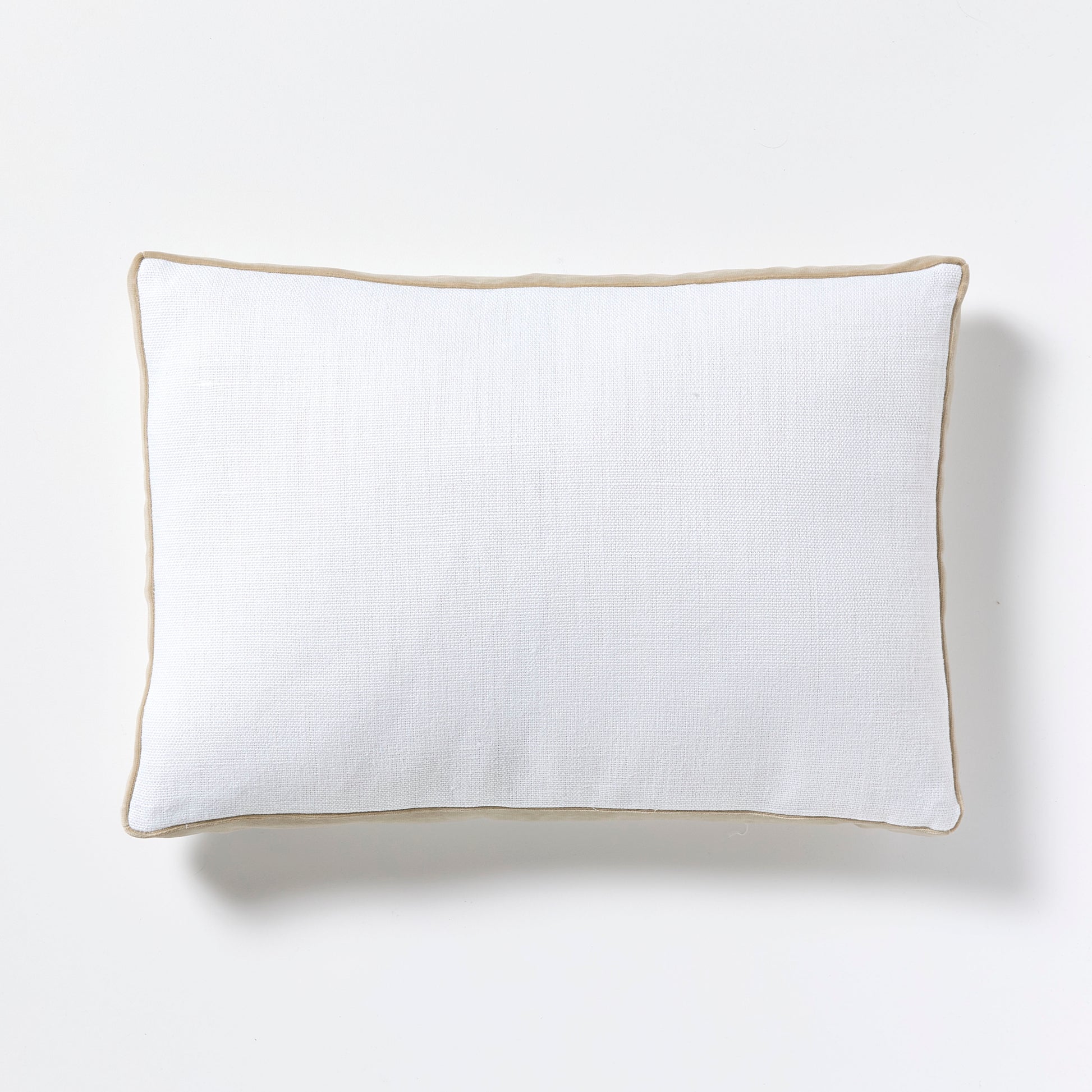 White linen lumbar pillow with khaki velvet gusseted trim.