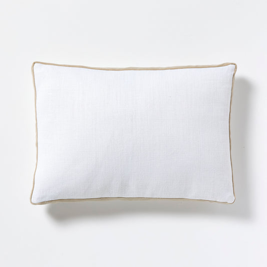 White linen lumbar pillow with khaki velvet gusseted trim.