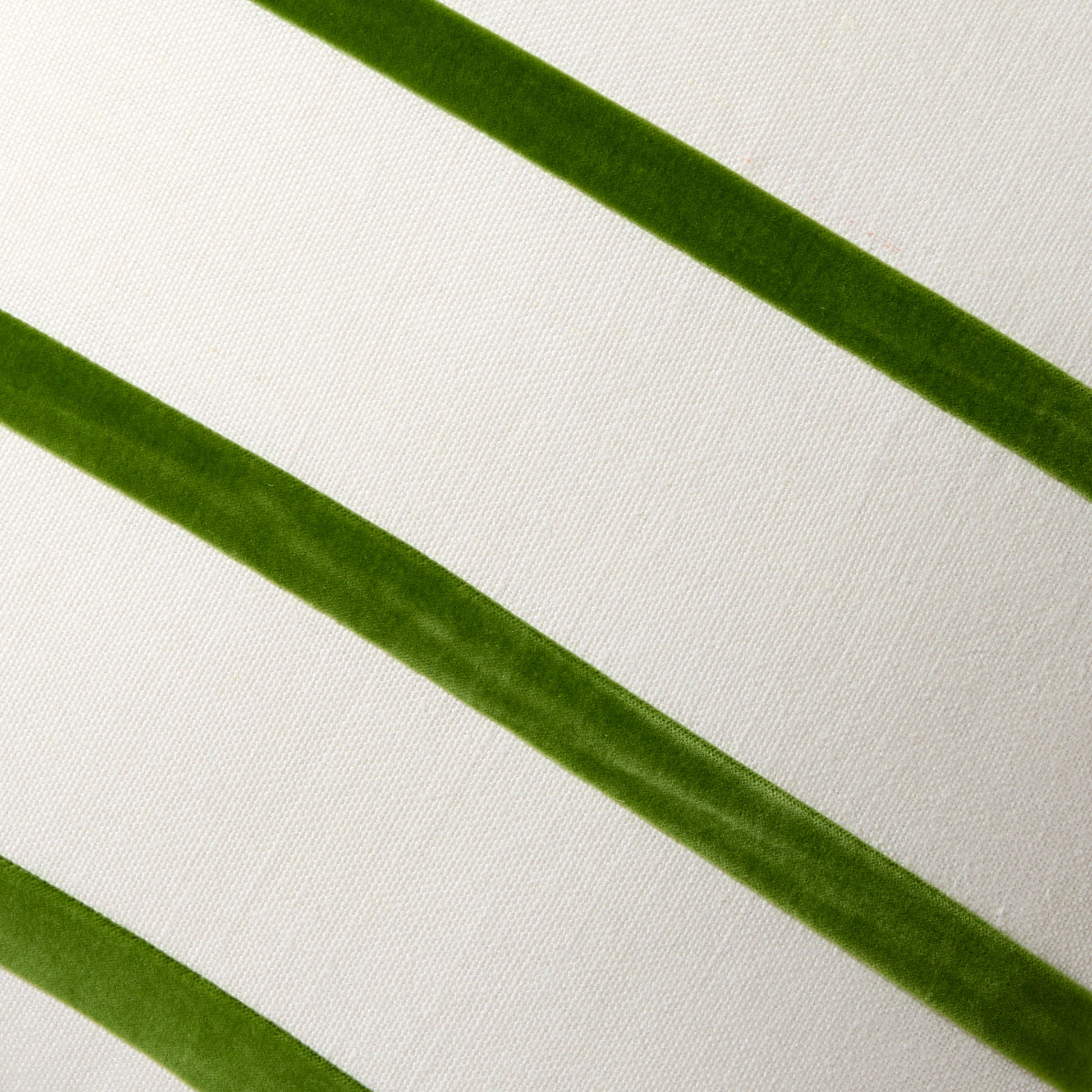 Kiwi green velvet stripes on an ivory Belgian linen pillow.