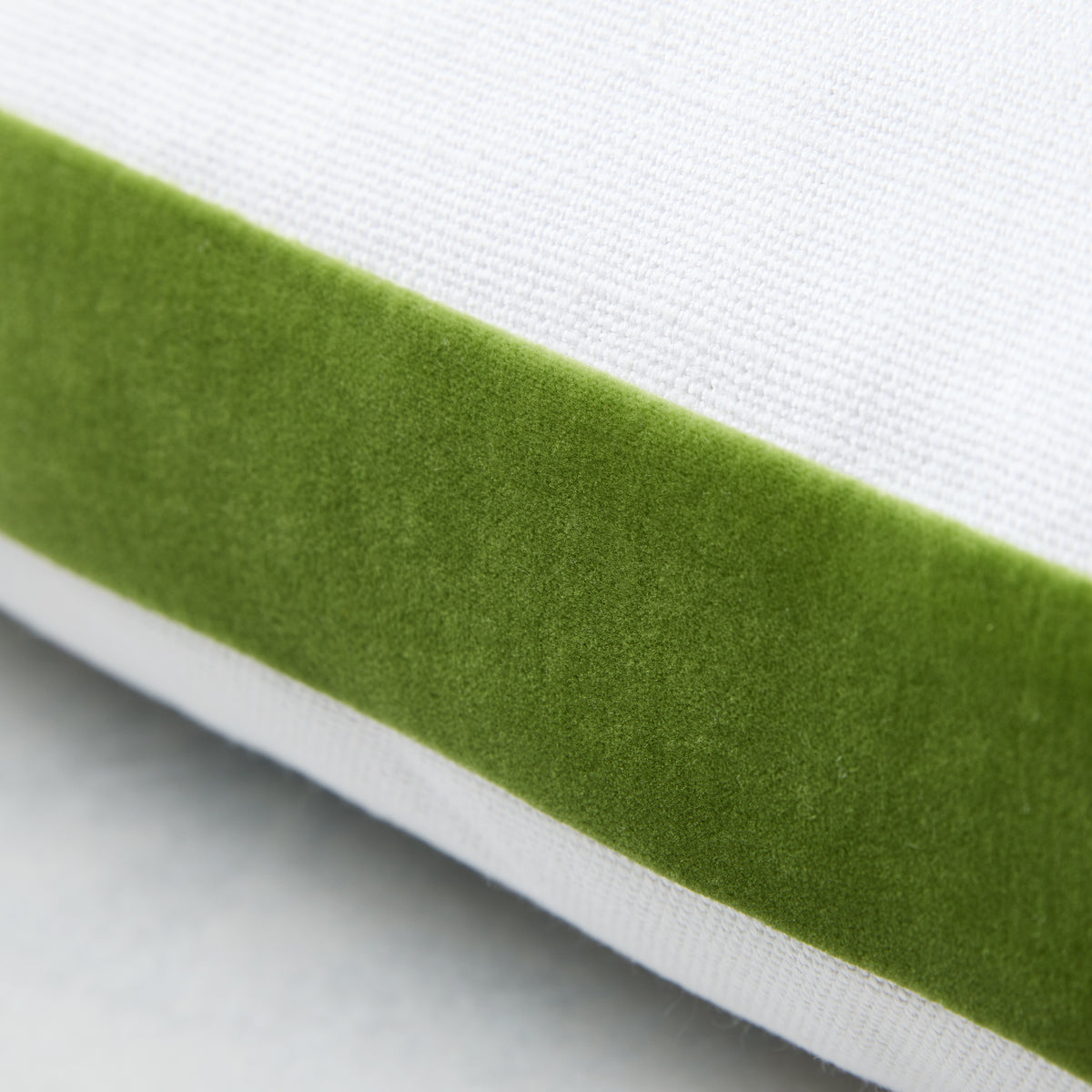 Kiwi green velvet gusseted square pillow with a white linen side, custom-made for Hudson Grace.