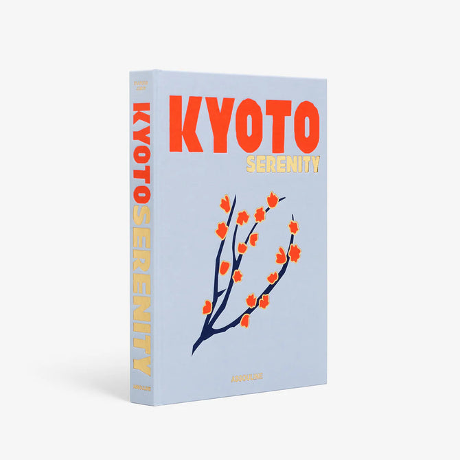 Hardcover "Kyoto Serenity" book, light blue with orange text and a dark blue branch with orange blossoms.