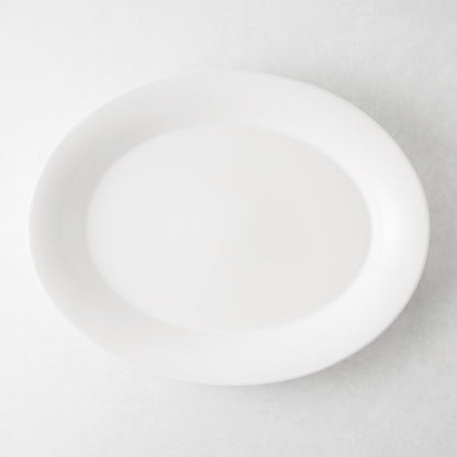 Lagos Large Ceramic Serving Platter, white oval, 18"L x 14"W, with raised edge.
