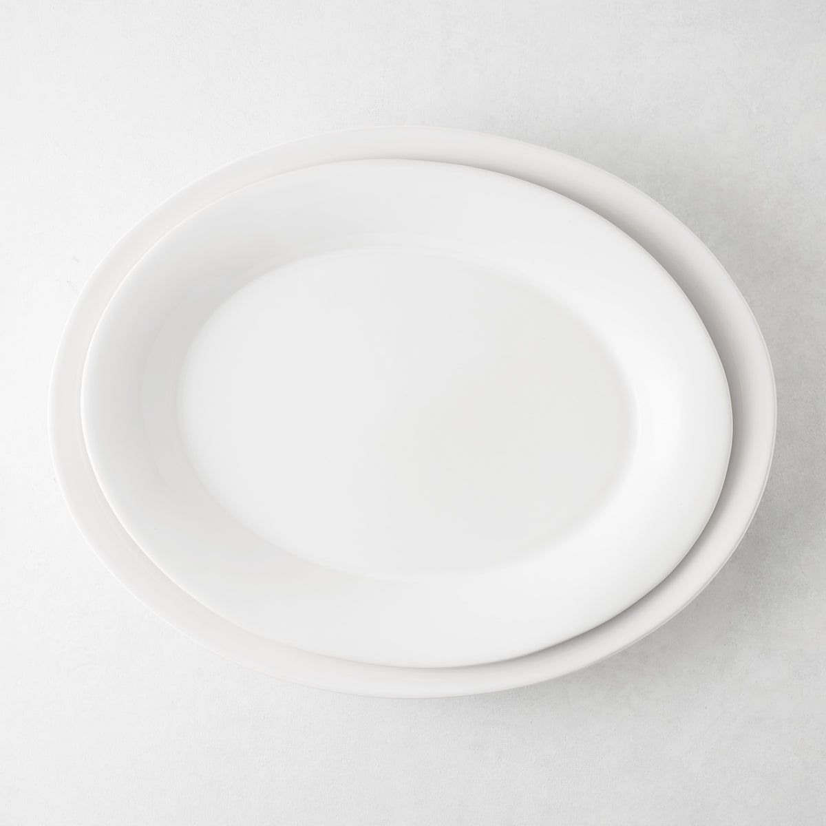 Lagos Large Ceramic Serving Platter, white glaze, oval, 18"L x 14"W, slightly raised edge.