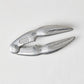 Laguiole Jean Dubost aluminum seafood crab cracker, claw-shaped, 5.5"L, with "FRANCE" embossed.