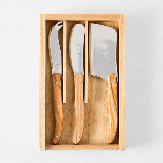 Laguiole 3-piece cheese knife set with stainless steel blades and olive wood handles in a wooden box.