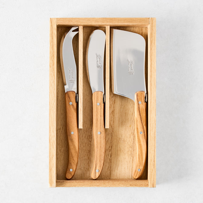 Laguiole 3-piece cheese knife set with stainless steel blades and olive wood handles in a wooden box.
