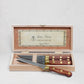 Set of 4 Laiton wood and brass stainless steel steak knives in an open wood box.