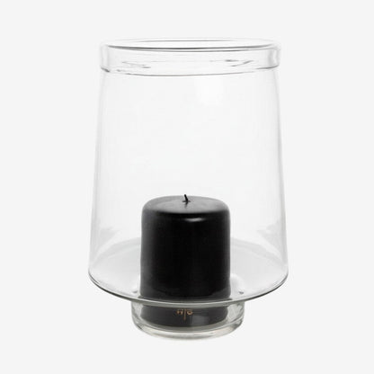 Hudson Grace large clear glass Antwerp hurricane candle holder with a black pillar candle and folded edge detail.