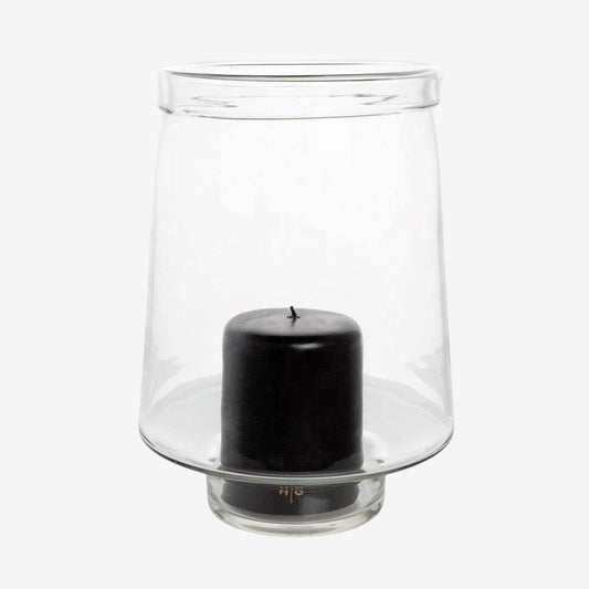 Large Antwerp clear glass hurricane candle holder with a black pillar candle inside.