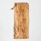 Large rectangular artisan olive wood serve board with natural grain and leather cord.