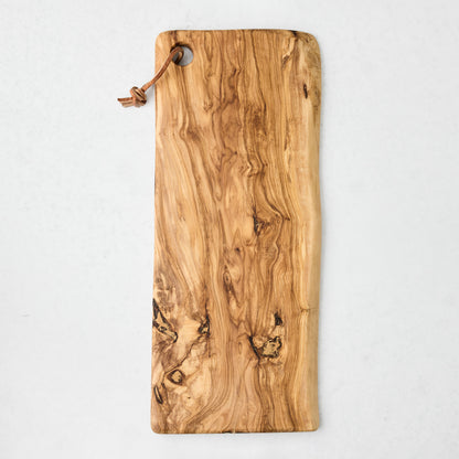 Large rectangular artisan olive wood serve board with natural grain and leather cord.