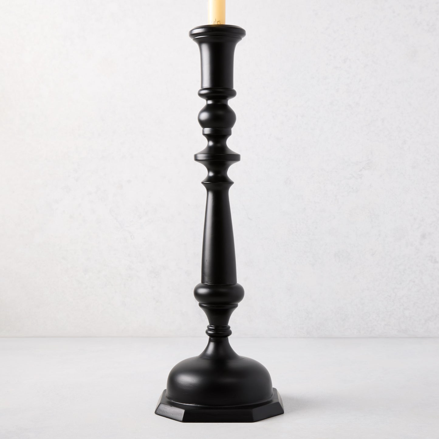 Large black lacquer Georgian candlestick, hand-carved beechwood, 19"H, with a cream taper candle.