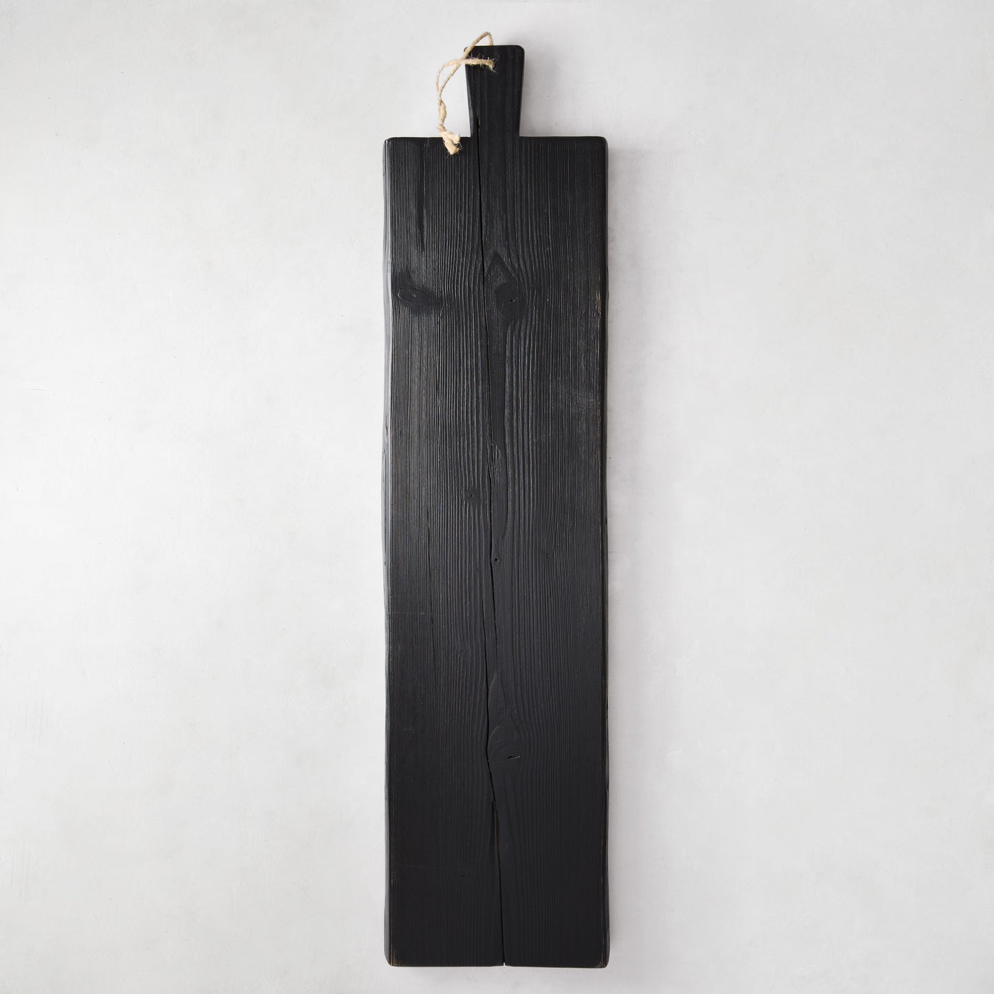 Large black reclaimed wood serving plank with handle and tag, 40"L x 10"W.