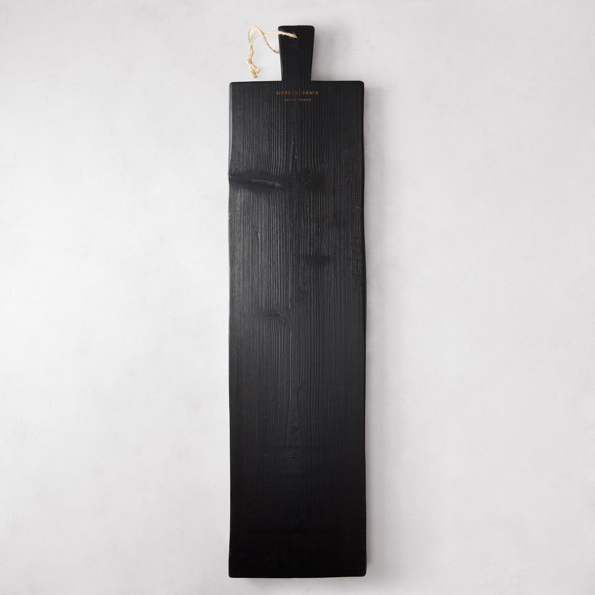 Long black reclaimed wood serving plank with handle and rope, 40"L x 10"W.