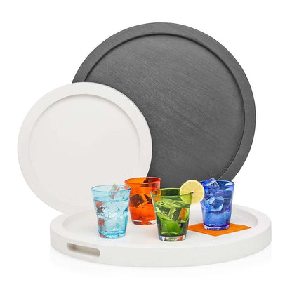 Large black and small white round wood serving trays with colorful drinks.