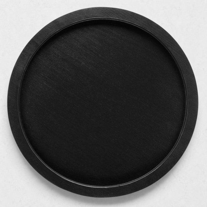 Large round black reclaimed pine wood serving tray with raised rim.
