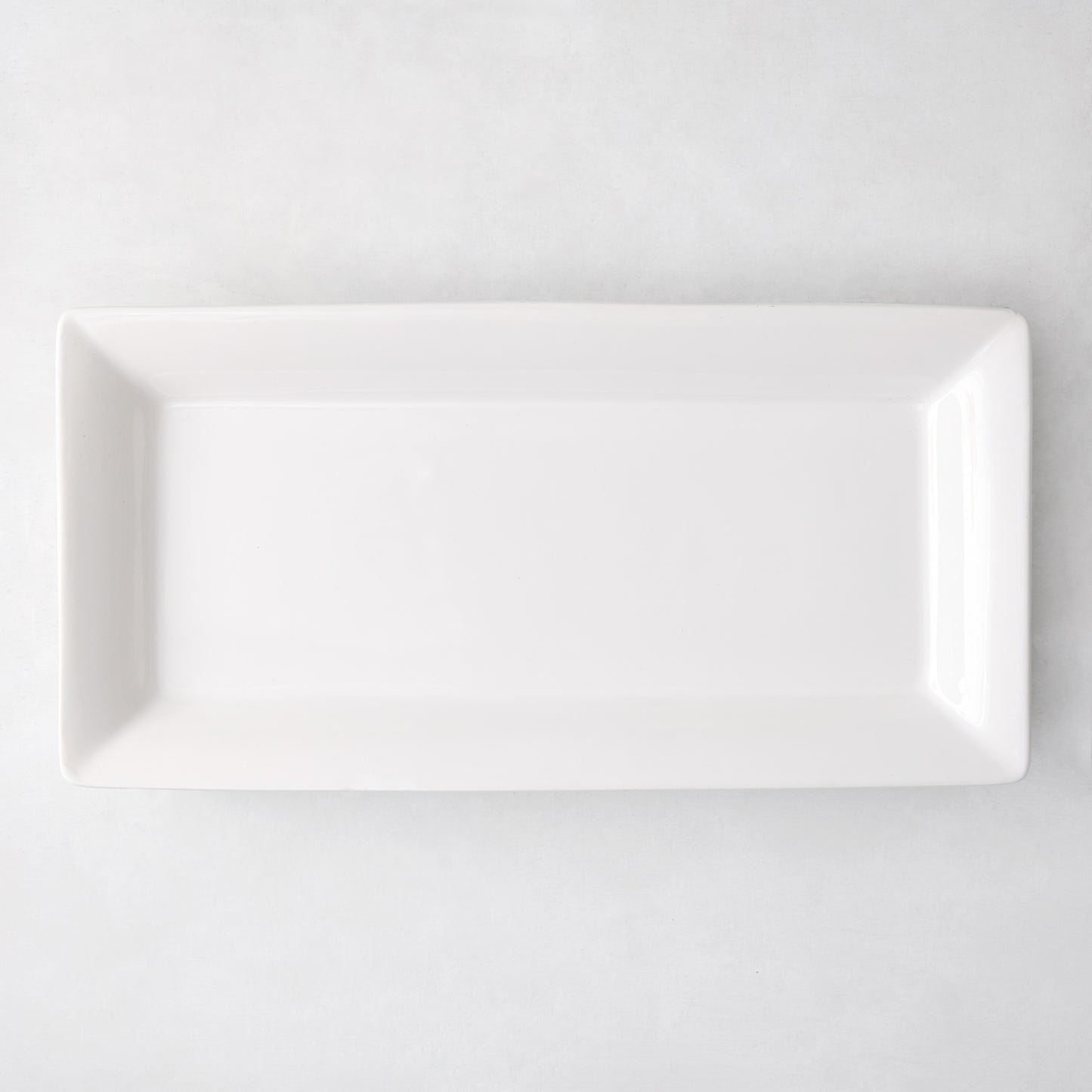 Large Lucca rectangular white ceramic serving platter with a sleek, modern edge.