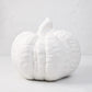 Large matte white ceramic pumpkin, 12"H x 10"Dia, with a short stem and ribbed texture.