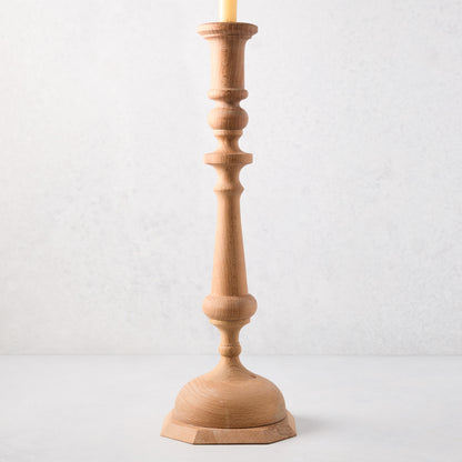 Large natural beechwood Georgian candlestick, 19"H, with a cream candle.