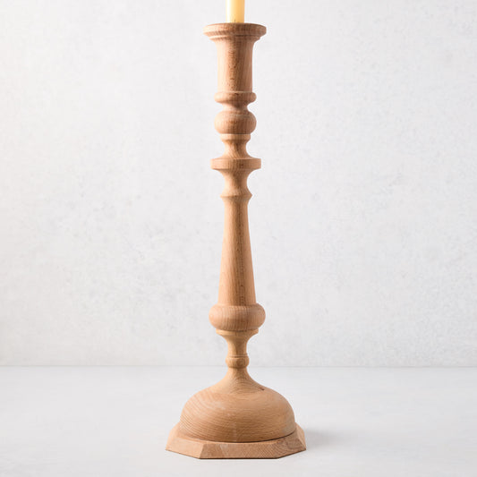 Large natural beechwood Georgian candlestick, 19"H, with a cream candle.