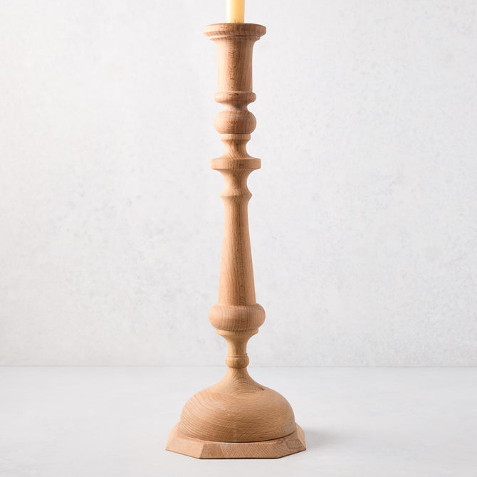 Large natural beechwood Georgian candlestick, 19"H, with a cream candle.