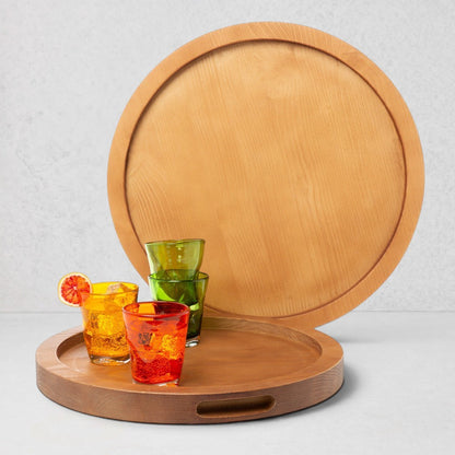 Large natural wood serving tray with cutout handles, holding colorful glasses.