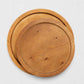 Two round natural reclaimed pine wood serving trays, one large and one small, with raised rims.