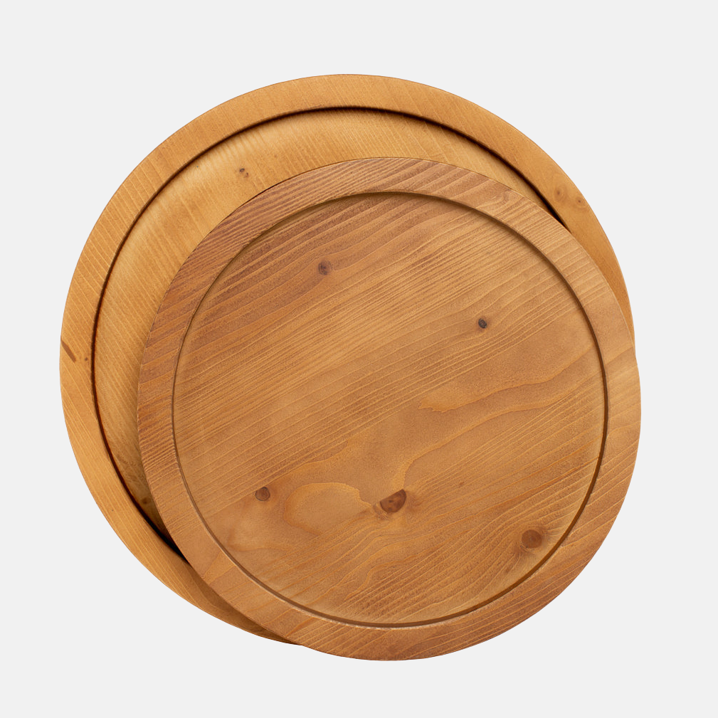 Two round natural reclaimed pine wood serving trays, one large and one small, with raised rims.