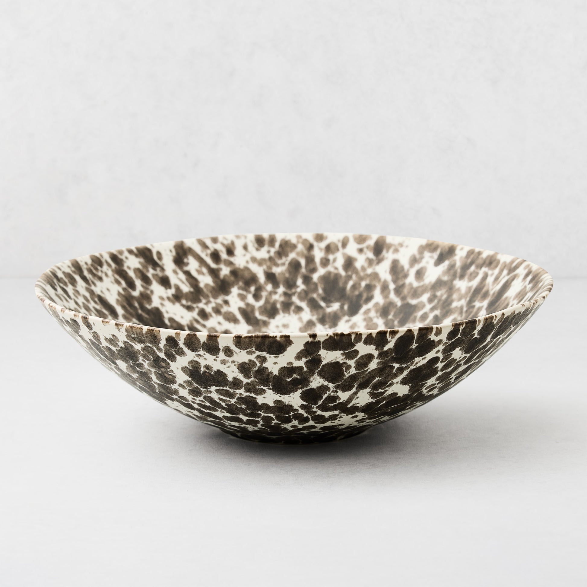 Large Nuno Splatter stoneware serve bowl, pale cream with unique brown spots.
