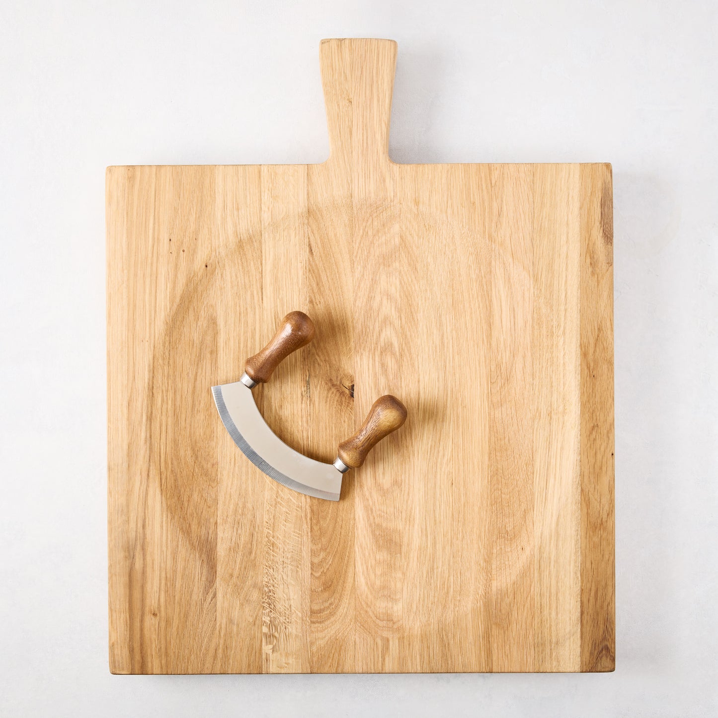 Large reclaimed oak wood cutting board bowl with a mezzaluna blade.