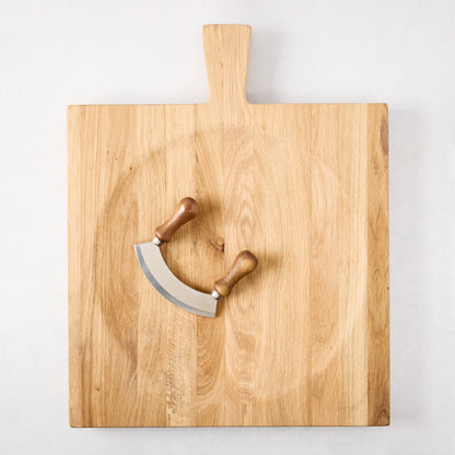 Large reclaimed oak wood cutting board bowl with a mezzaluna blade.