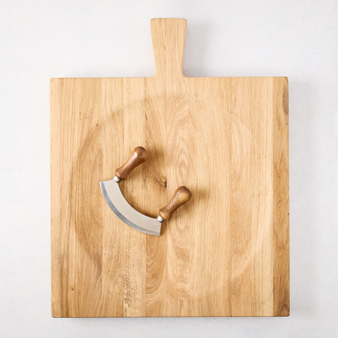 Large reclaimed oak wood cutting board bowl with a mezzaluna blade.