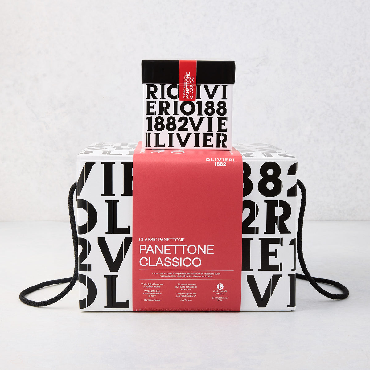 Large Olivieri Classic Panettone in a white box with black typography and a bold red center band with black rope handles.