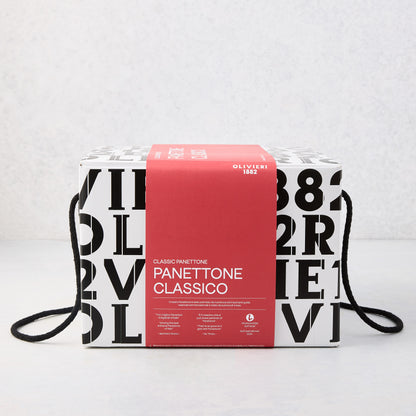 Large square box of Olivieri Classic Panettone with black typography, a red paper band, and black rope handles.